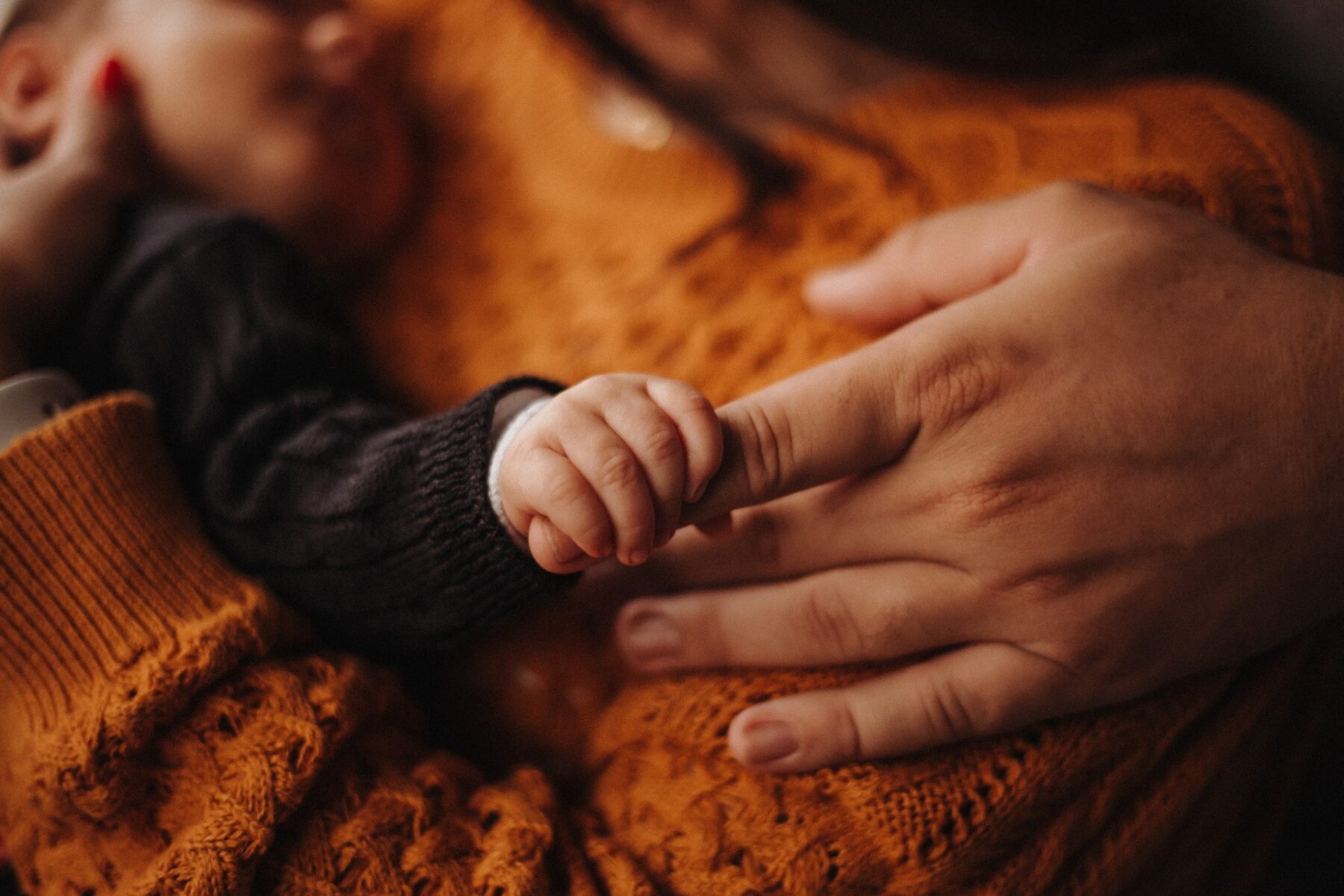 Child holding finger.