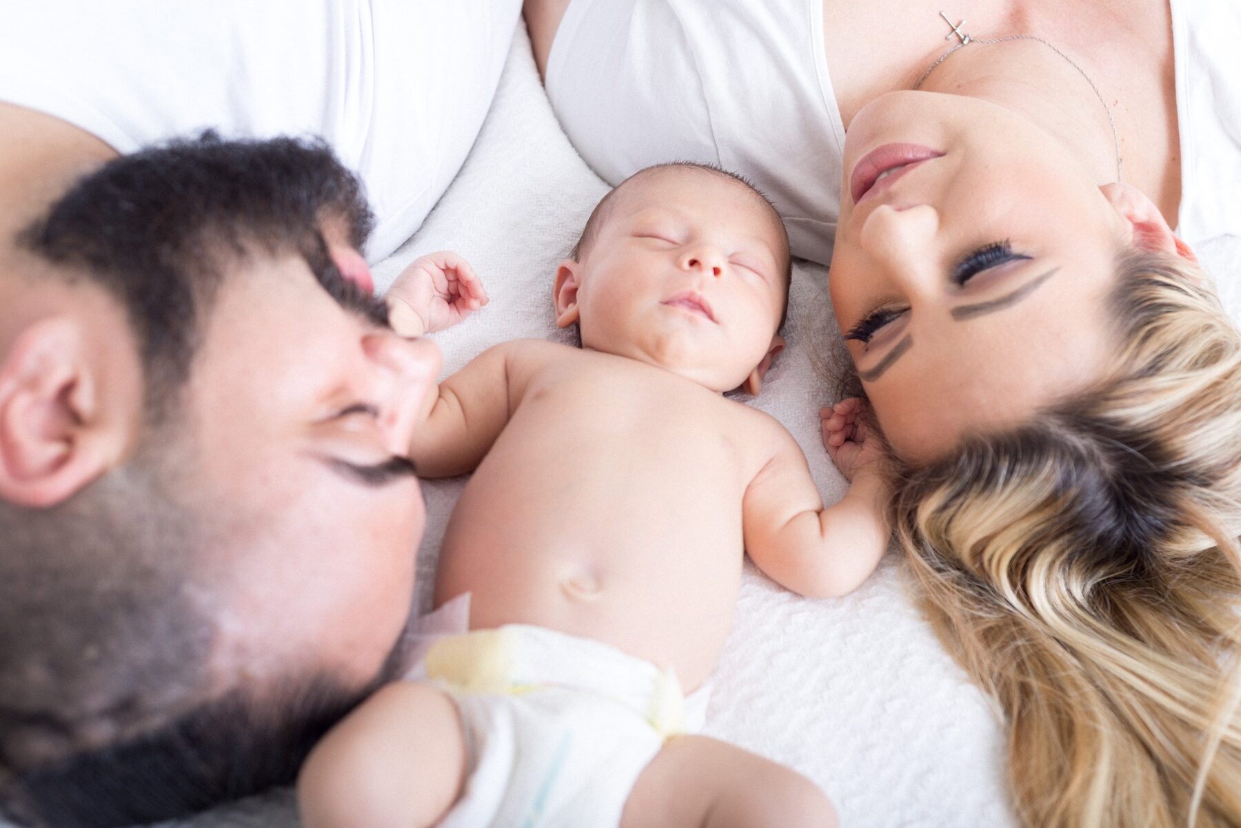 baby with family sleeping